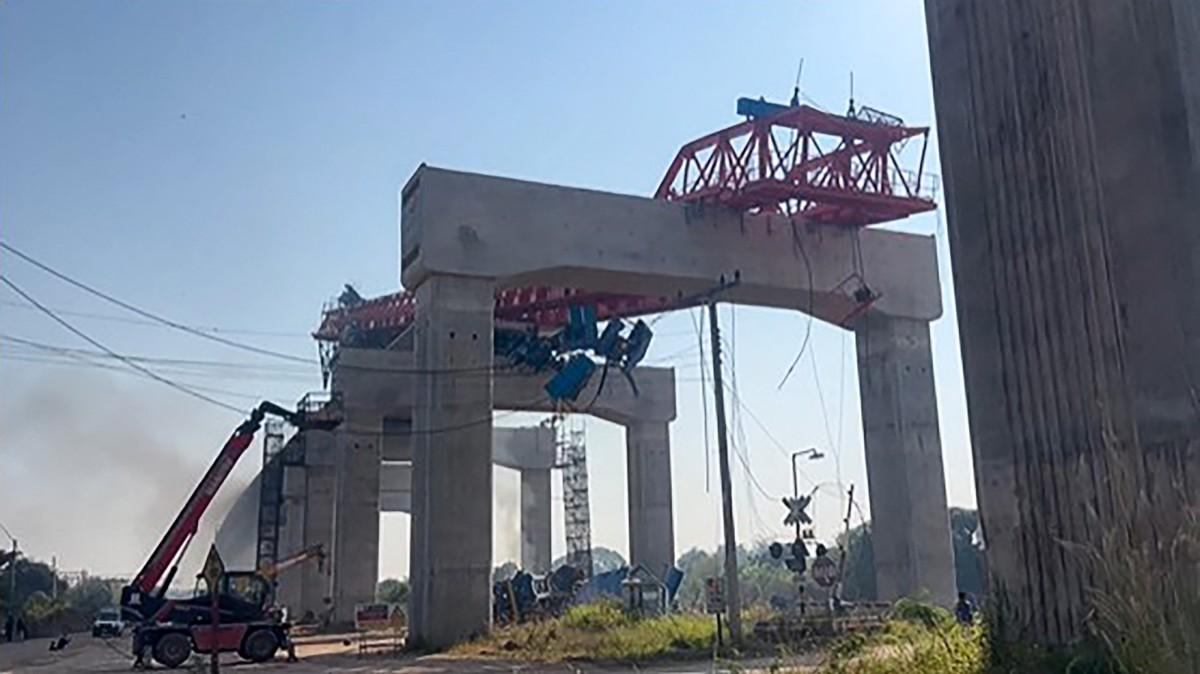This screen grab made from UGC handout video footage courtesy of Facebook user Smith Mikle taken and released on January 14, 2026 shows the wreckage of a train that crashed after a construction crane collapsed. Photo: AFP