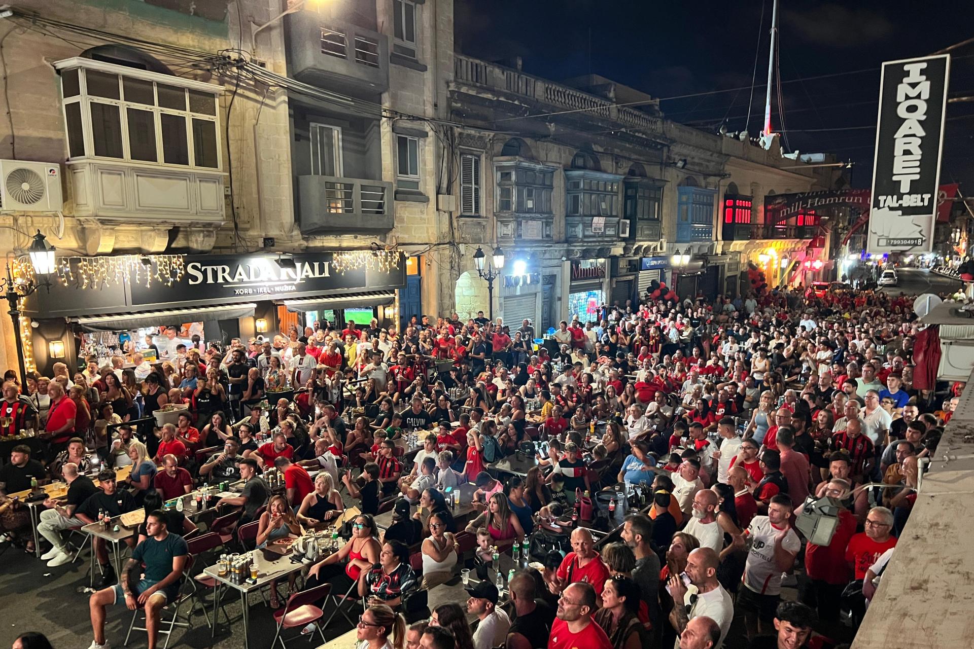 Supporters watching the match on screens on the main high street. Photo: Chris Sant Fournier.
