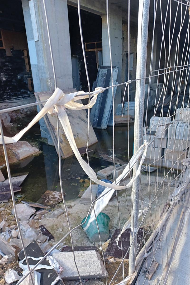 Stagnant water at the unfinished site is attracting mosquitoes.