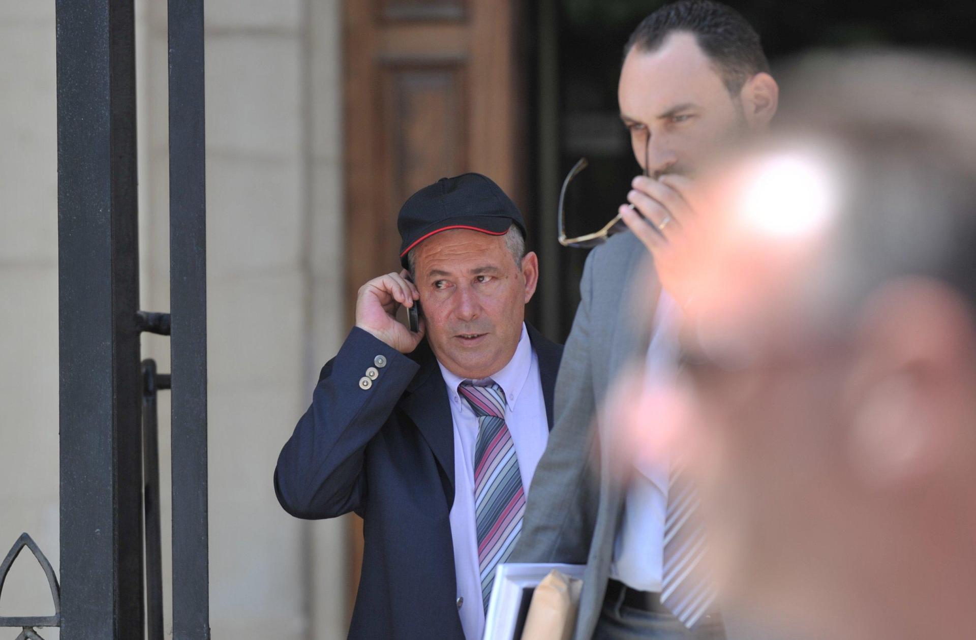Vince Muscat (wearing cap), one of the three triggermen.