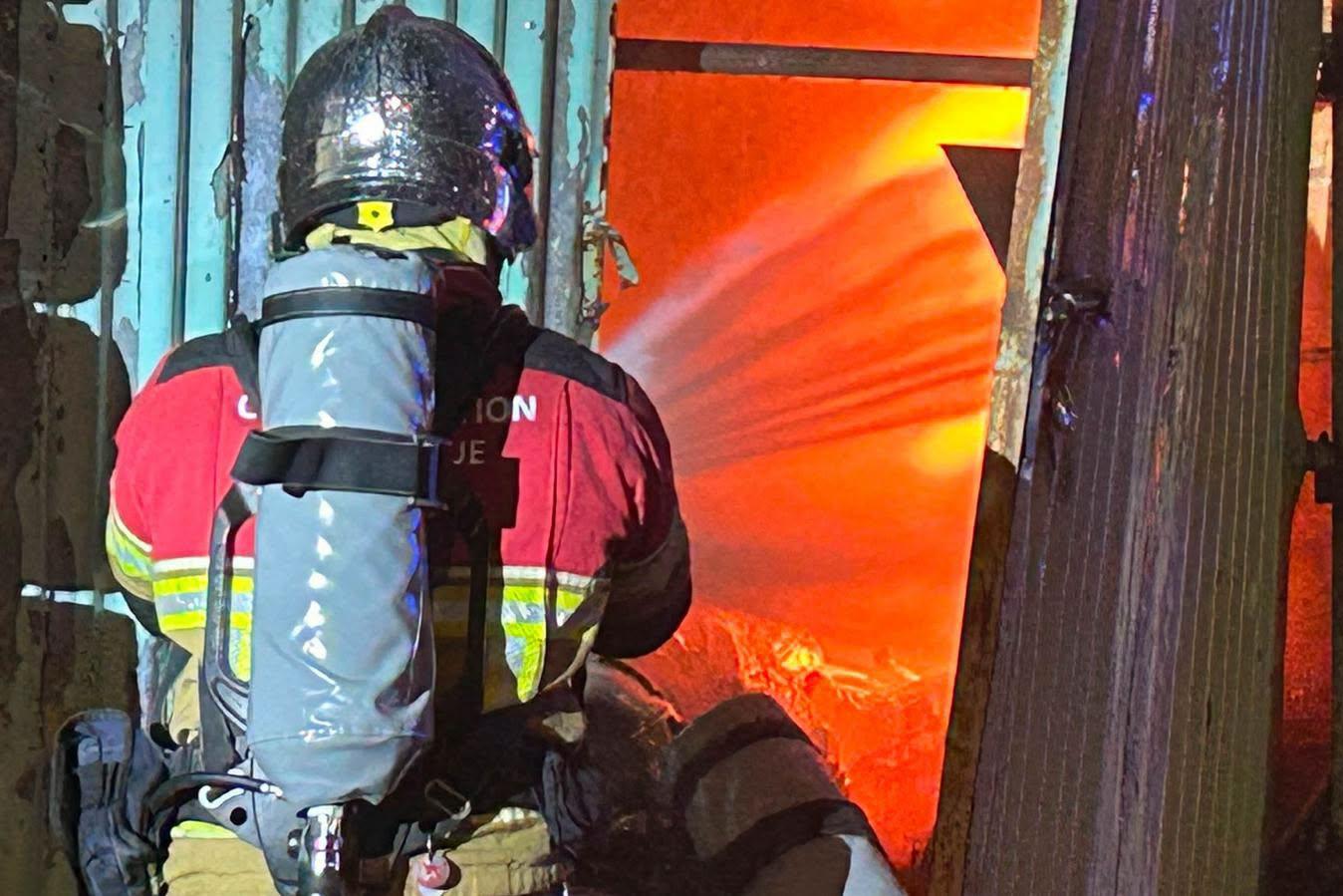 A firefighter sprays the fire in Zabbar. (CPD)