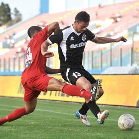 Clayton Failla defends possession for Hibernians yesterday.