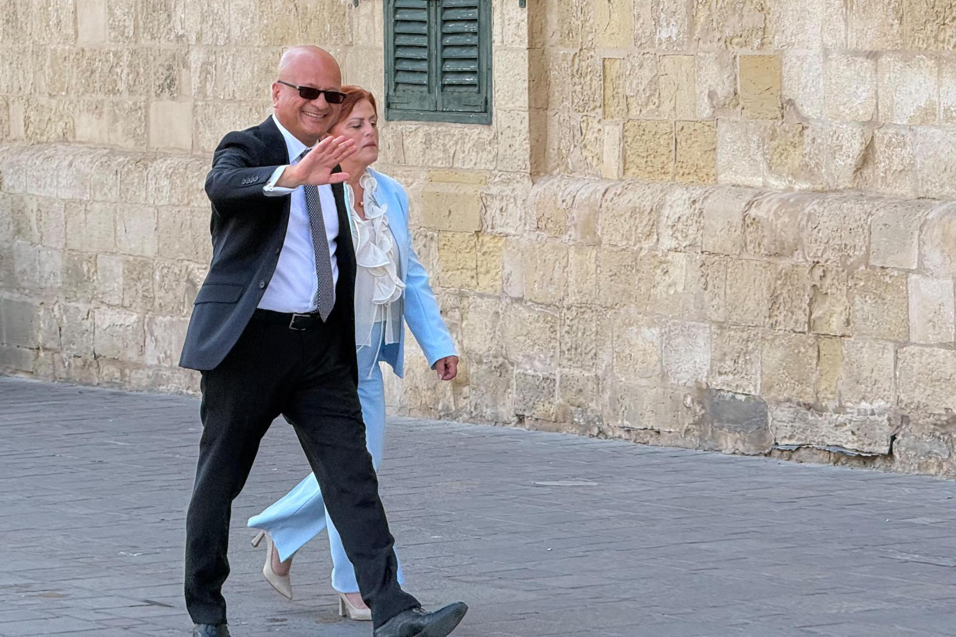 Deo Debattista waves as he arrives for his swearing-in ceremony as parliamentary secretary. Photo: Kristina Vella