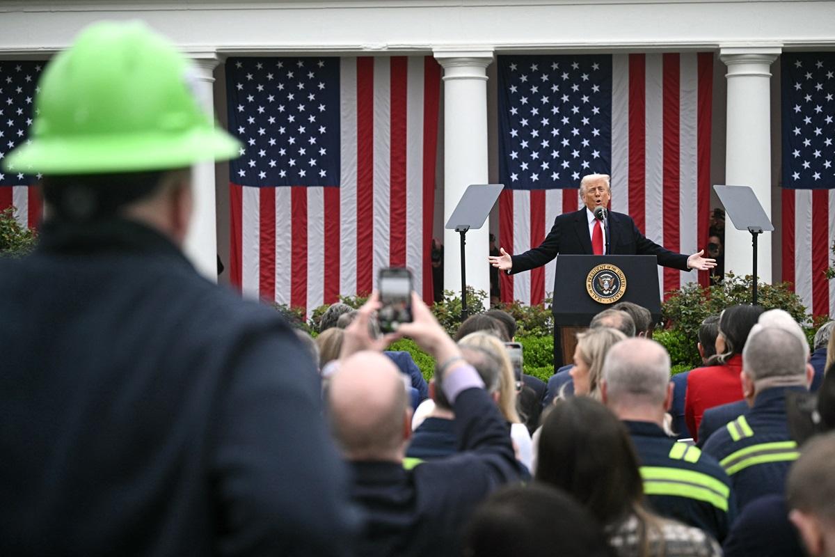 Trump's Rose Garden audience included steel and auto workers. AFP