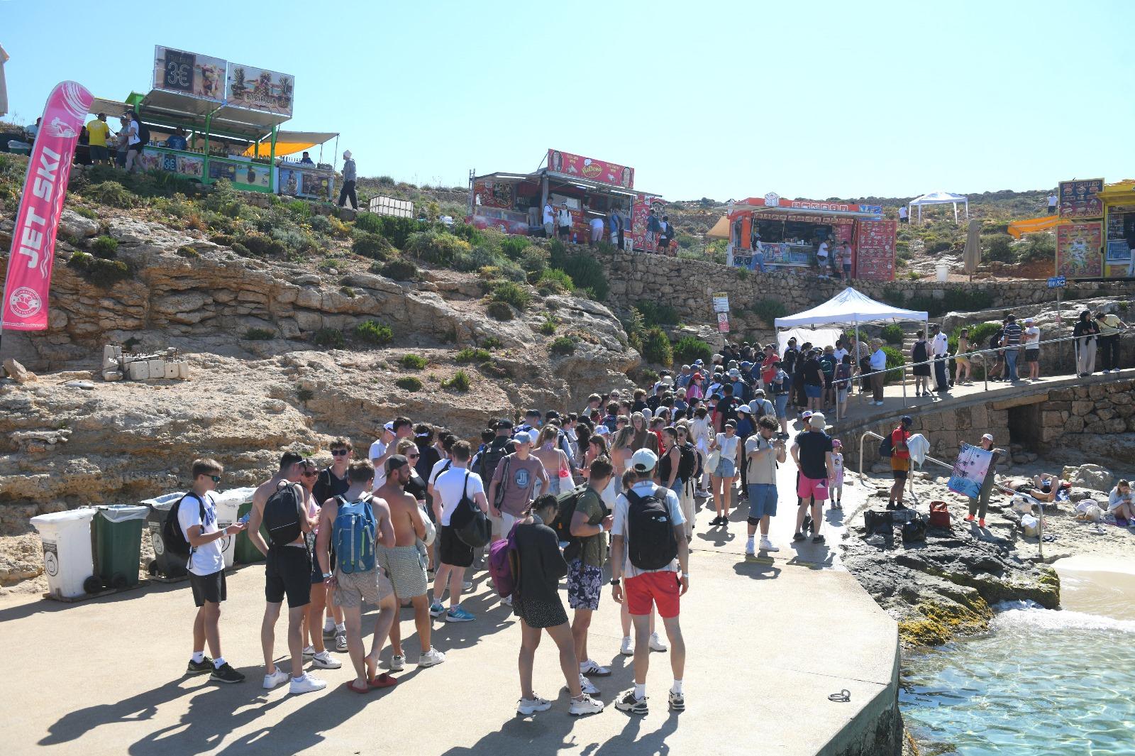 Tourists queueing to drop their towel at Blue Lagoon.