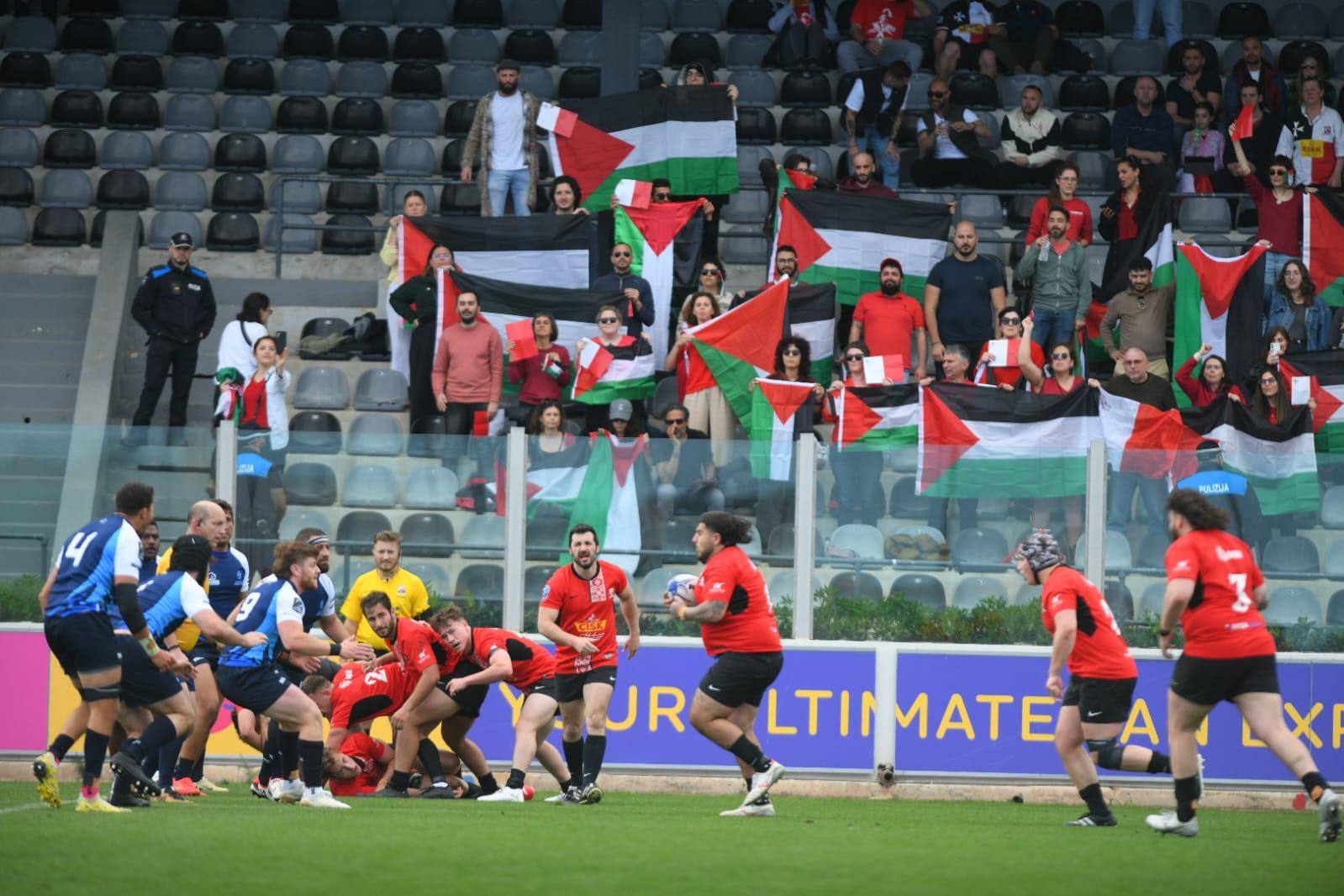 Protestors maintained activities throughout the start of the match. Photo: Matthew Mirabelli.