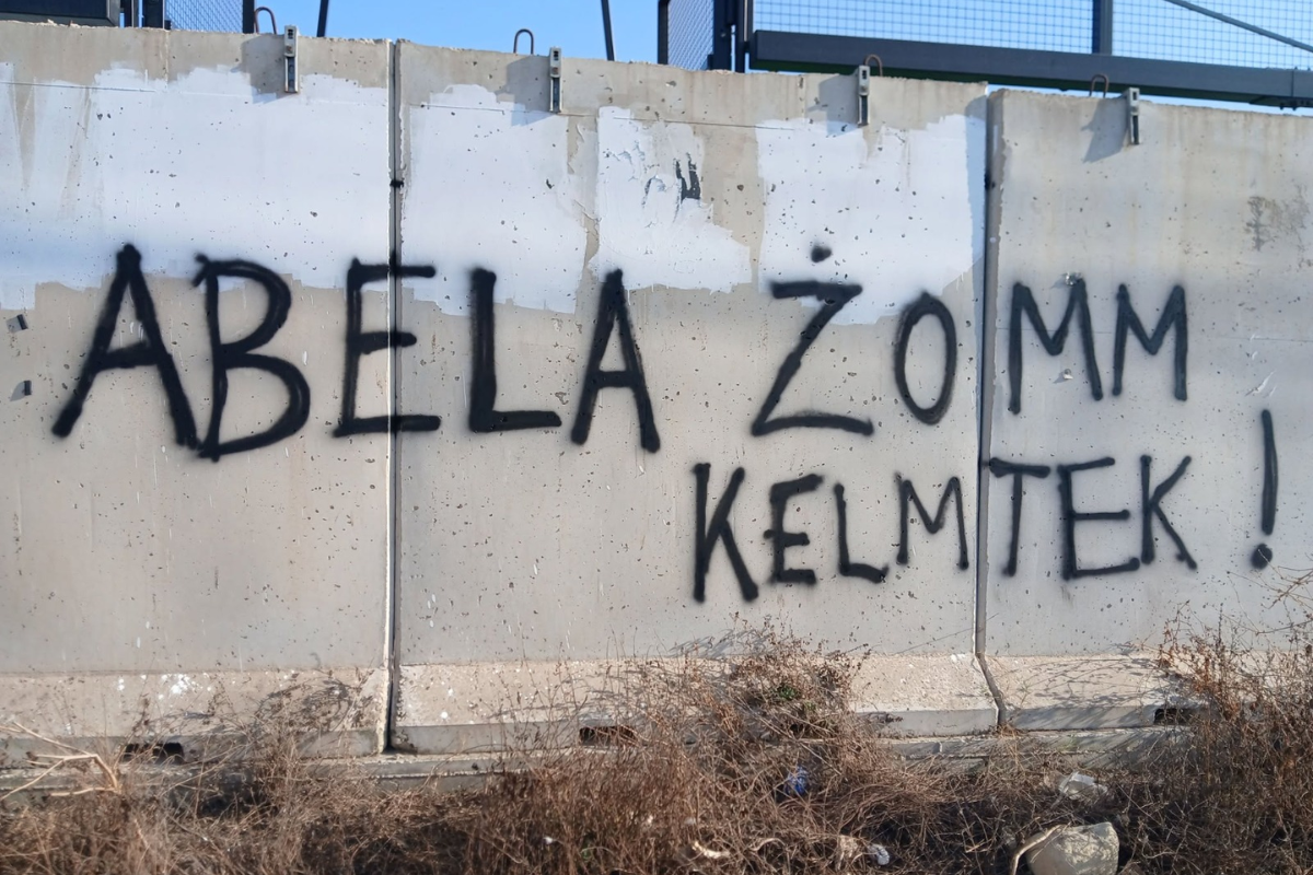 'Abela Żomm Kelmtek!' (Abela keep your promise!) spray painted on concrete slabs at the site of the padel courts.