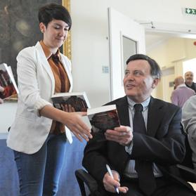 Former Prime Minister Alfred Sant signing his latest publication George Bush f&rsquo;Malta. Photo: Chris Sant Fournier