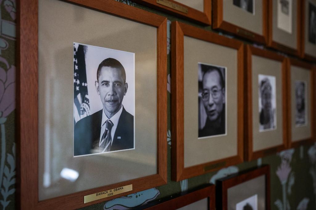 A portrait of former US president Barack Obama, Nobel Peace Prize laureate of 2009, next to other photographs of laureates on a wall of the committee meeting room at the Norwegian Nobel Institute. Photo: AFP
