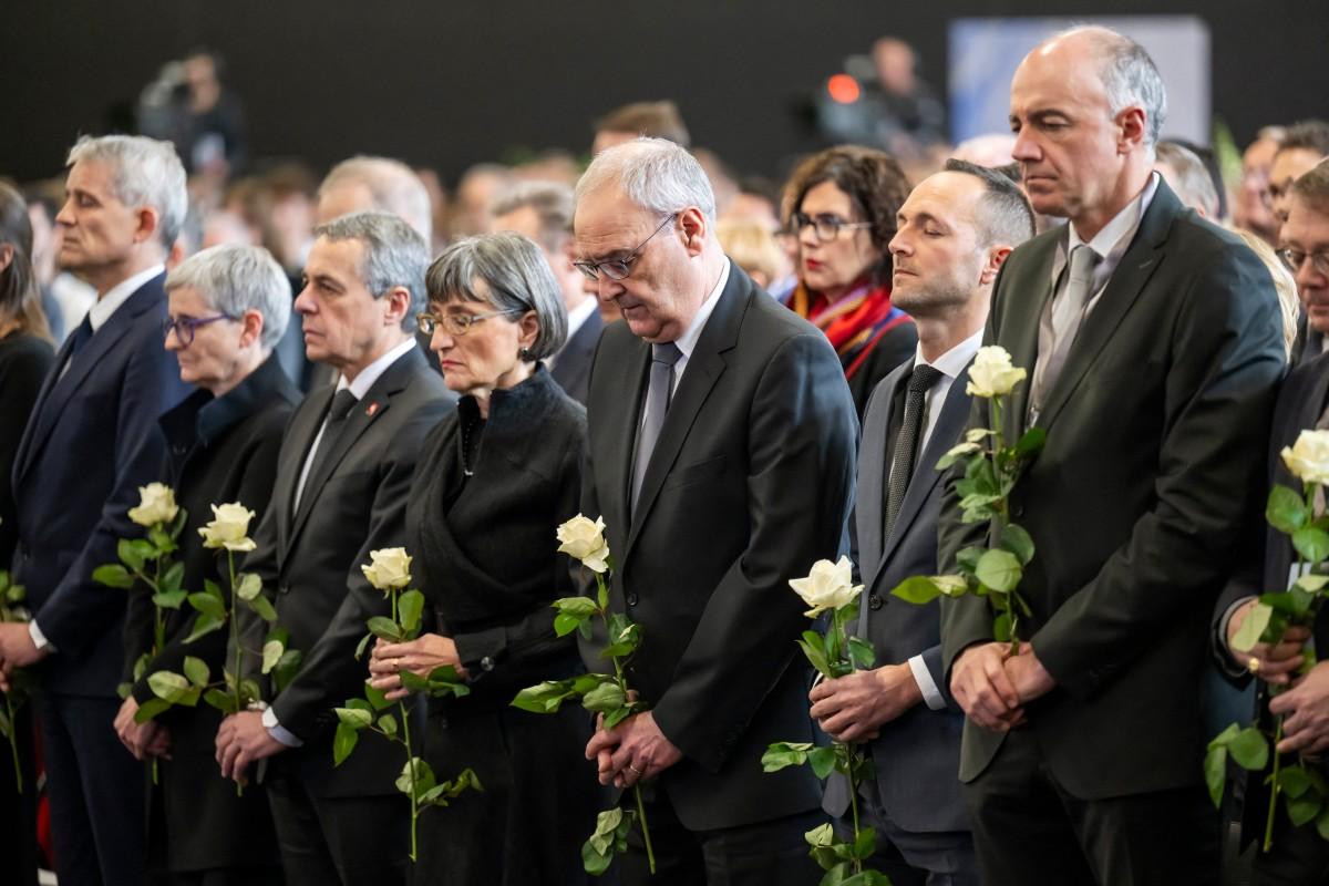 Swiss president Guy Parmelin (third from right) attends a tribute for the victims of the New Year's fire. Photo: AFP
