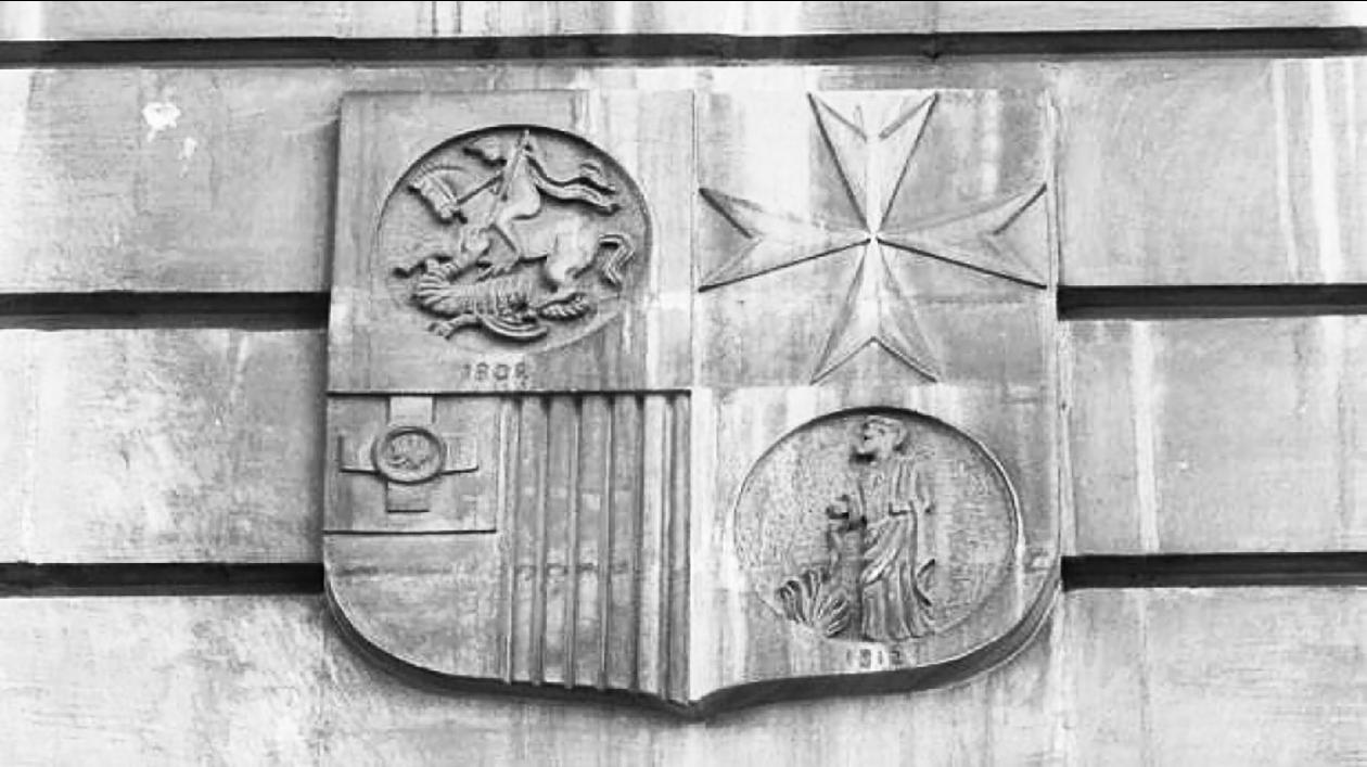 The emblem of the National Bank, founded in 1946, on its 'Strada Rjali' headquarters