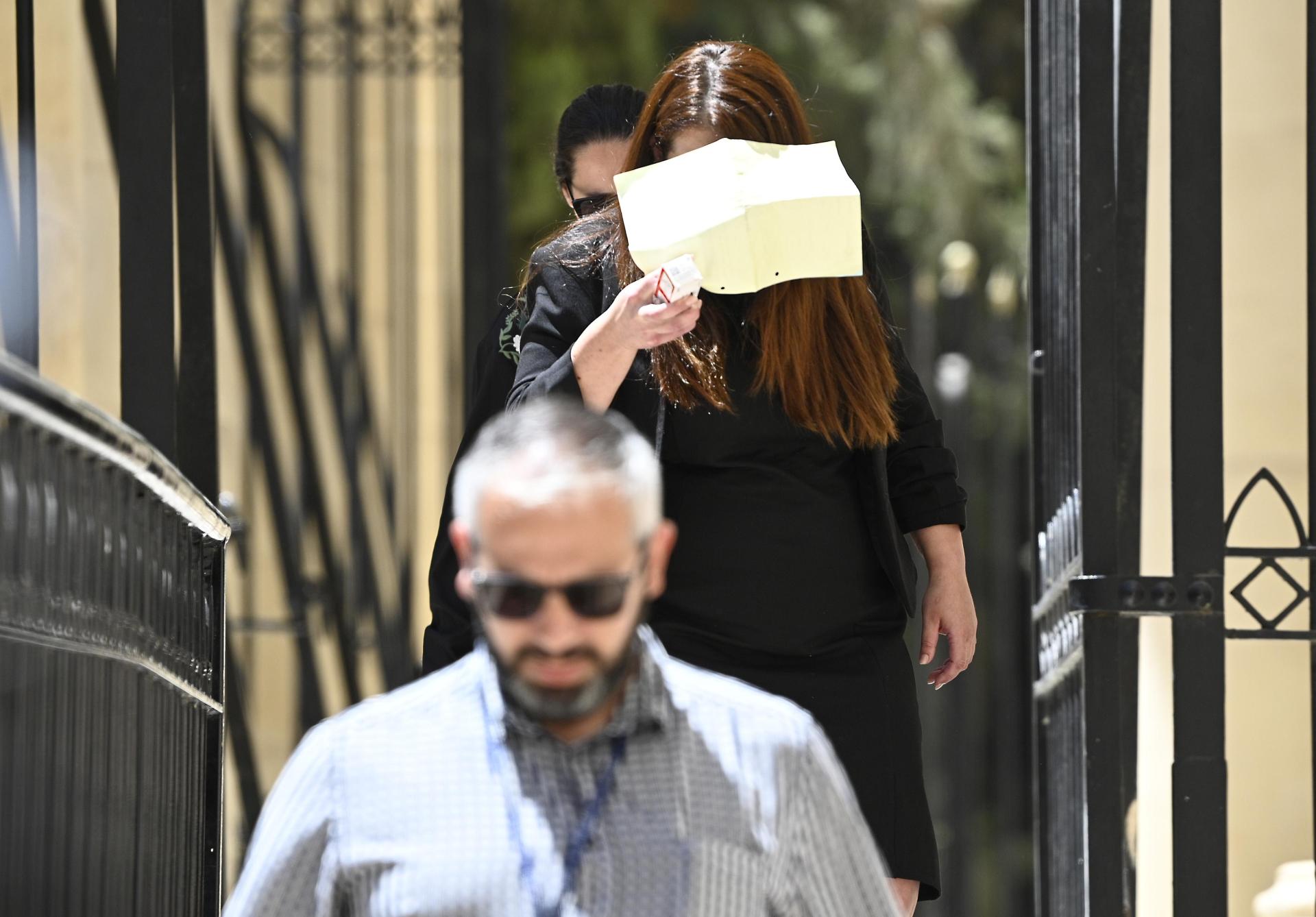 Francine Farrugia covered her face when she was arraigned earlier this month. Photo: Matthew Mirabelli