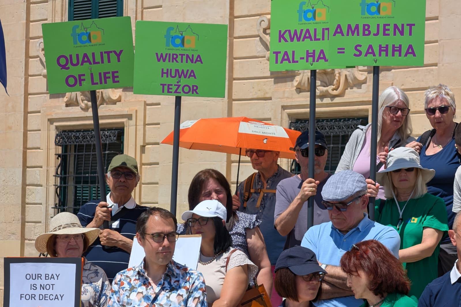 Residents in front of Castille holding placards. Photo: Chris Sant Fournier