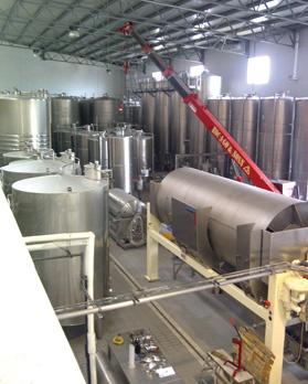 A new 10-hectolitre white wine tank being lowered into place at the winery&rsquo;s fermentation hall.