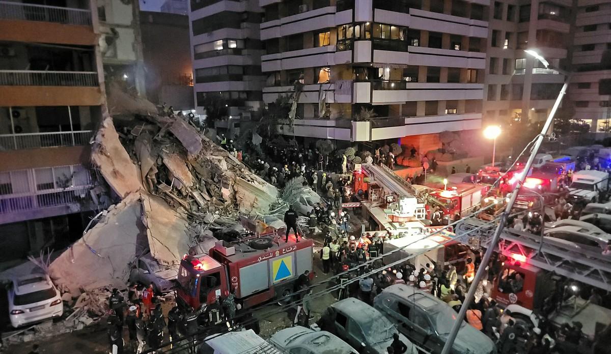 First responders and residents gather at the site of an Israeli airstrike in Beirut's Tallet al-Khayyat neighbourhood. Photo: AFP
