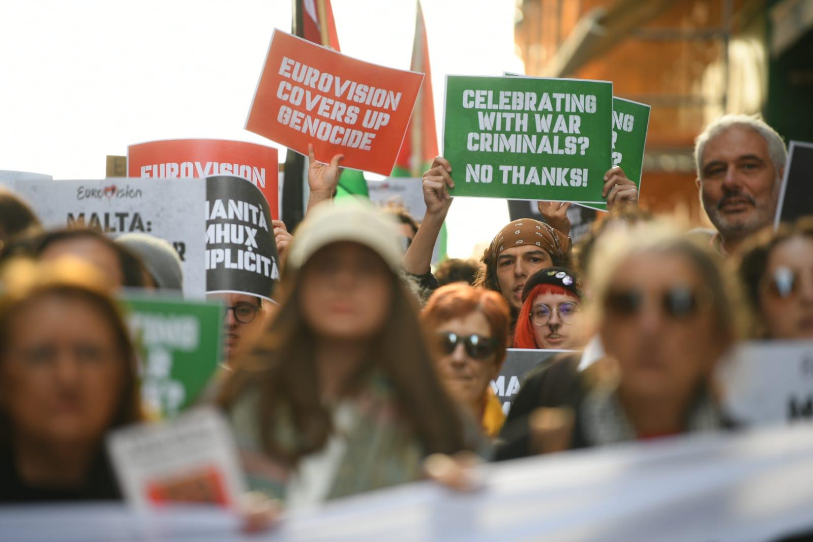 Demonstrators holding placards as they made their way through the capital Photo: Matthew Mirabelli