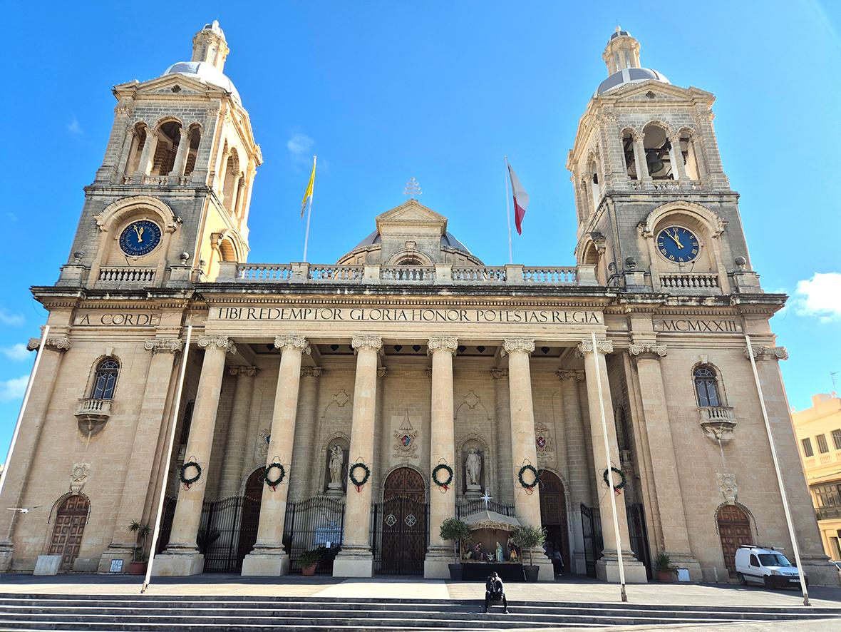 The inscription on the fa&ccedil;ade of Christ the King basilica. Photo: shutterstock.com
