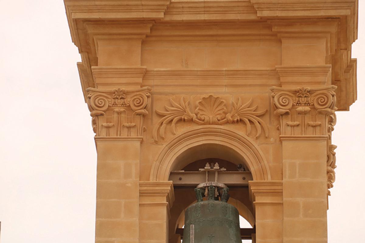 The intricate stonework on one of the belfries.