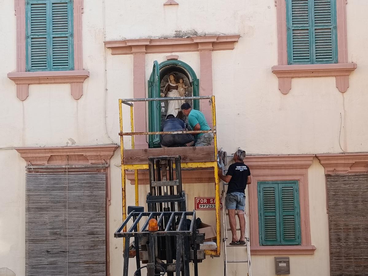 Brothers Loreto and Vincent Vassallo, together with James Vassallo, one of Vincent’s sons, are pictured carrying out cleaning and maintenance work on the niche.