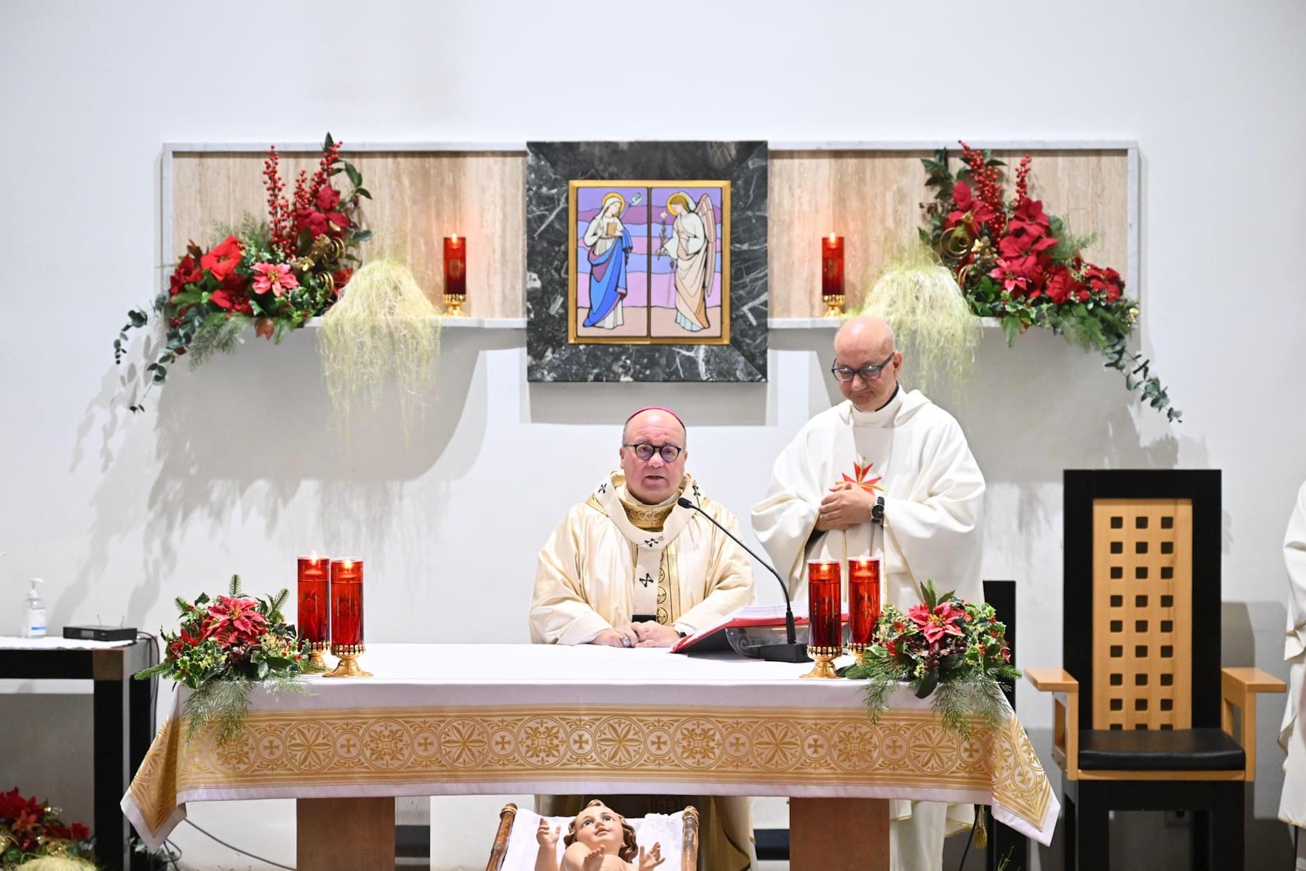 Archbishop Charles Scicluna saying mass at Dar tal-Providenza with Fr Martin Micallef (right). Photo: Archdiocese of Malta