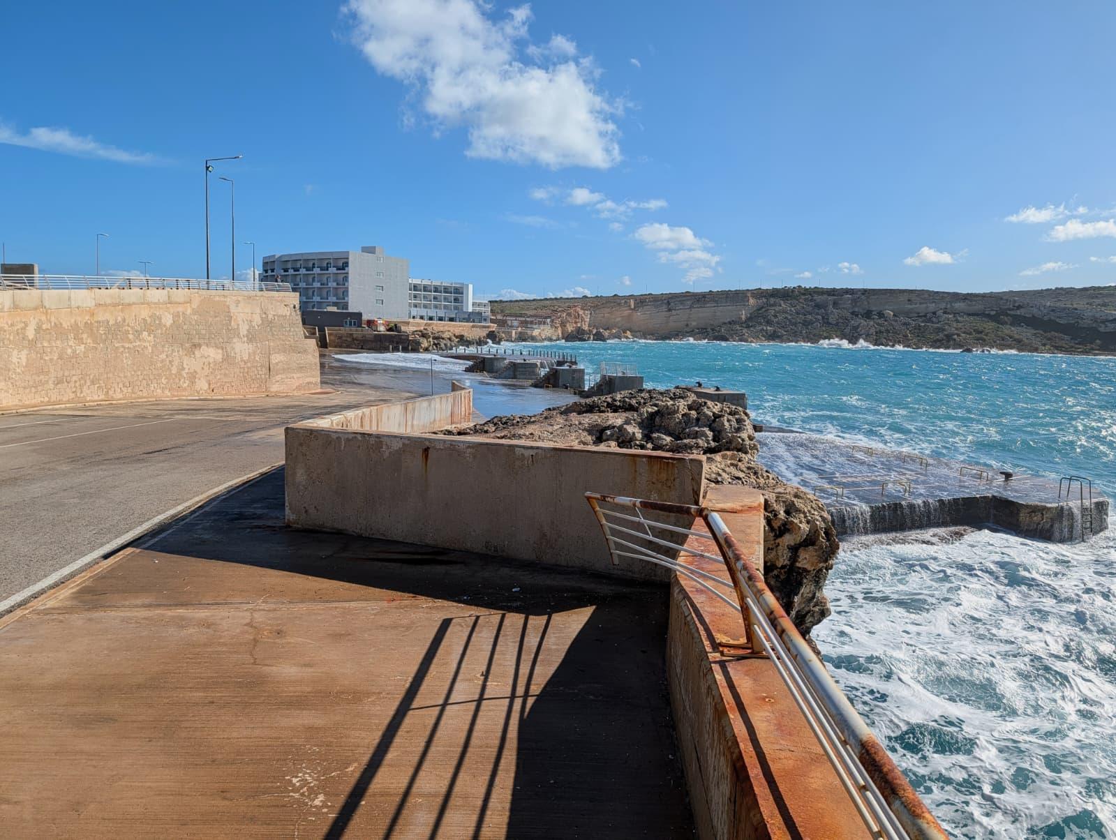 The family was behind this rail when a large wave swept the girl into the sea. Divers found her body close to where she disappeared. Photo: Chris Sant Fournier