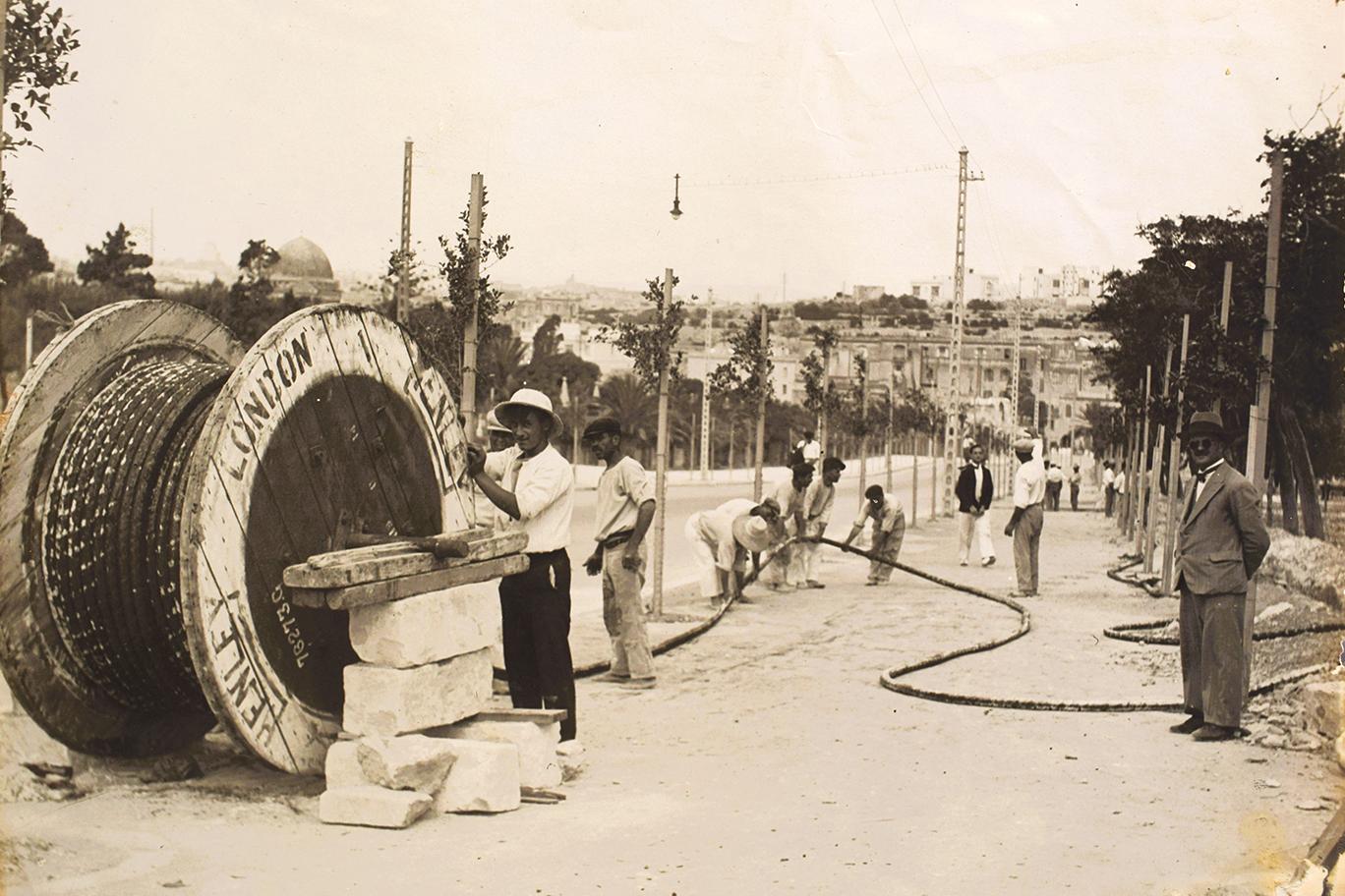 Laying heavy duty electrical cables, c.1930s.