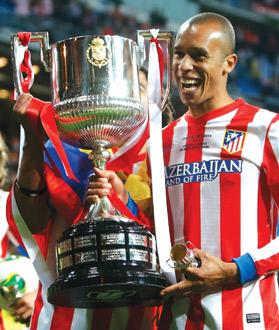 Atletico Madrid&rsquo;s match-winner Joao Miranda holds the Spanish King&rsquo;s Cup.