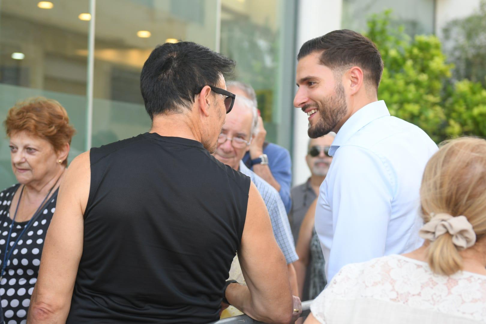 Alex Borg, right, speaks to voters. Photo: Matthew Mirabelli