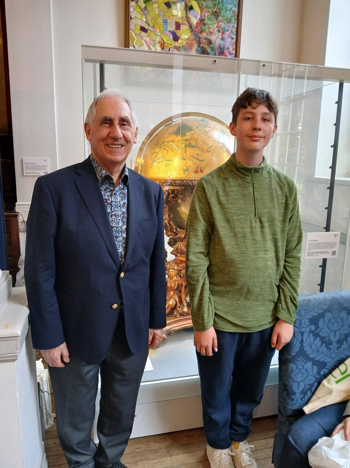 Schir&ograve; with IMCoS&rsquo; youngest ever member, 14-year-old Finlay Wilks, at the Royal Geographical Society in London during its annual map fair.