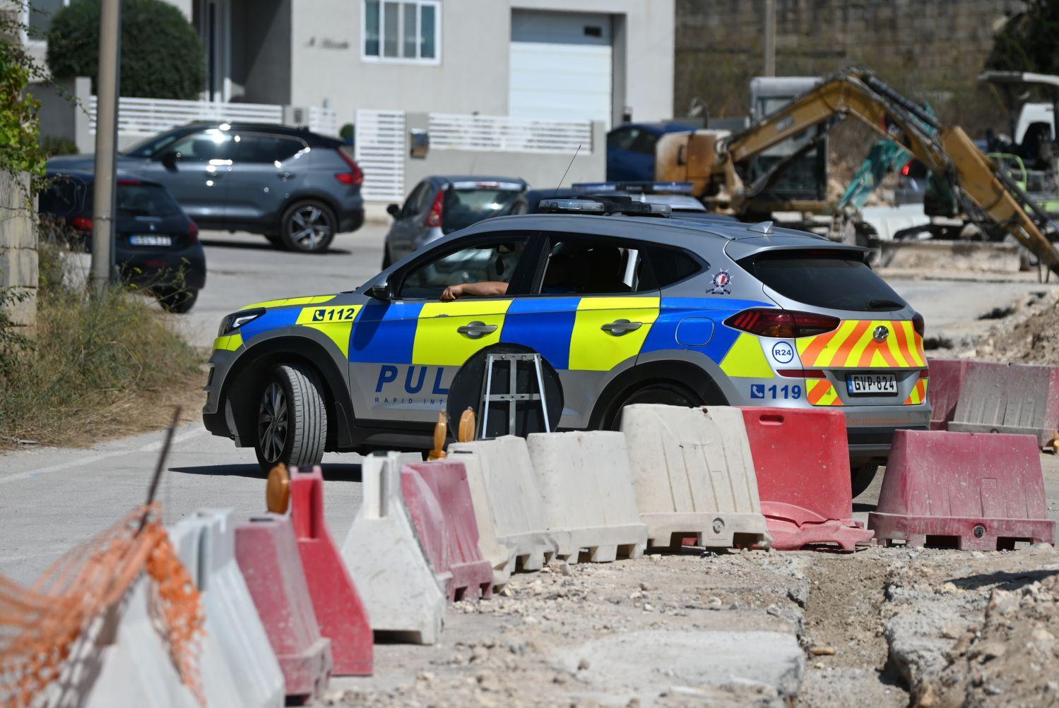 A police car drives through the area where roadworks are ongoing. Photo: Jonathan Borg