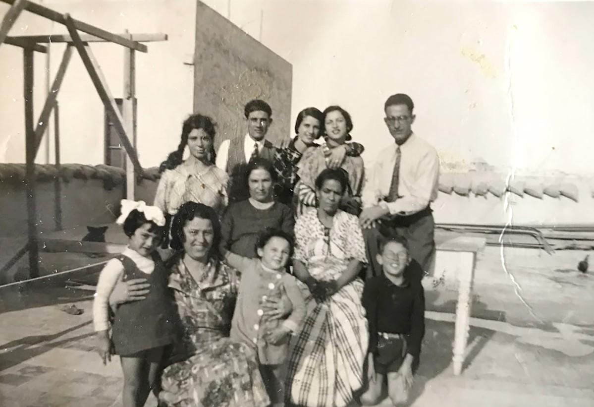 The Cassars on the roof of their family home in Tripoli, 1930s. Young Giovanna Cassar is the little girl with the pinafore in the front row. Photo: Family archive