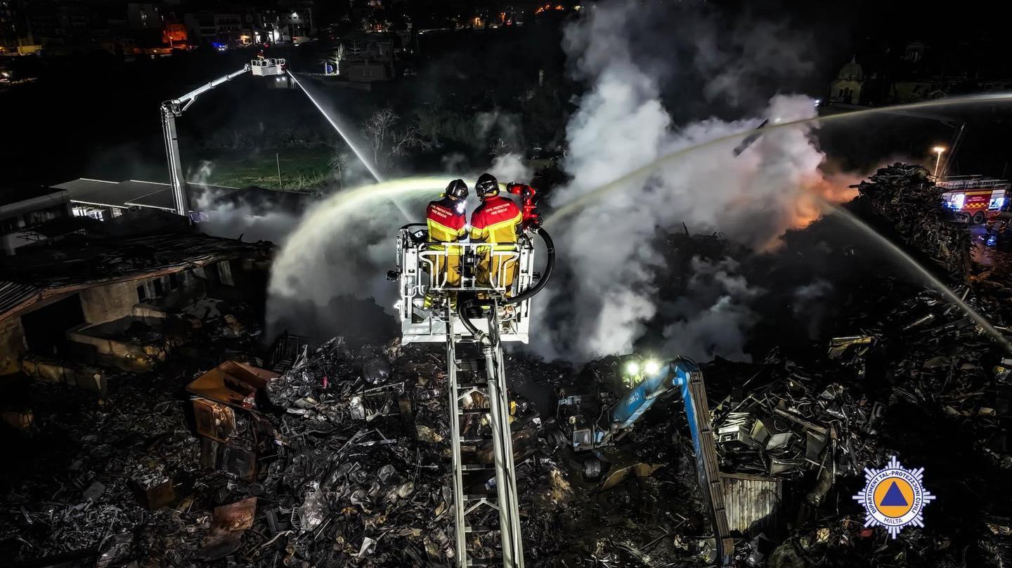 CPD firefighters were still working on the scrapyard fire 12 hours later. Photo: CPD