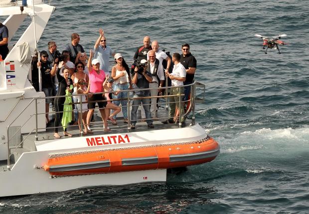Michelle Muscat Accompanied by her Prime Minister husband Joseph Muscat, acknowledge the cheers from a crowd of supporters in Marsamxett harbour moments after Michelle completed her ten kilometer swim in aid of charity on July 20. Photo: Chris Sant Fournier