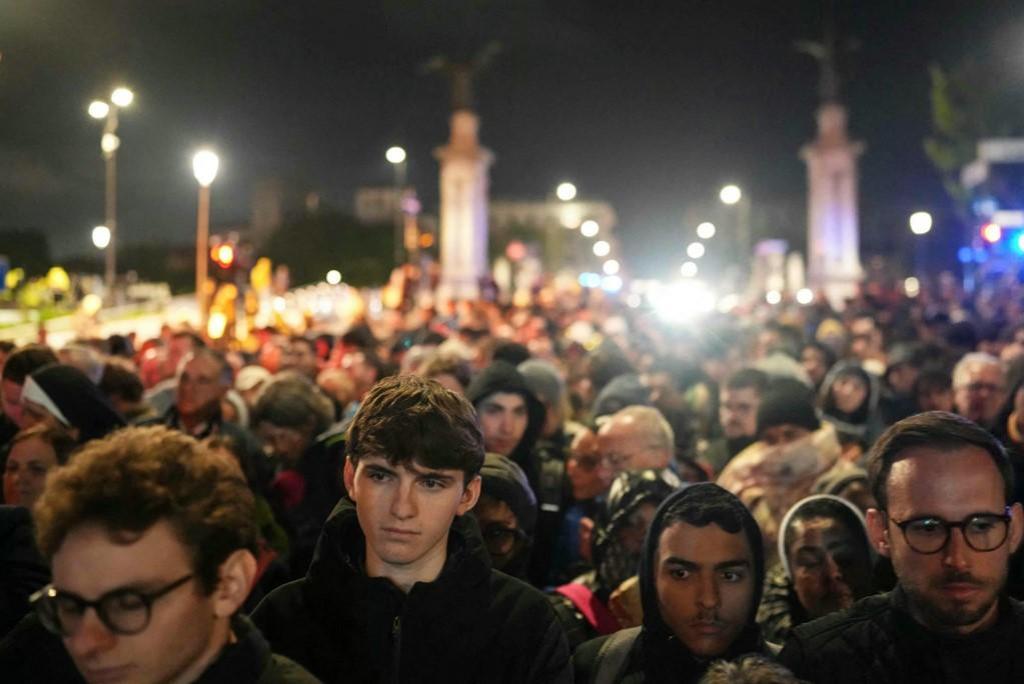 People queue up to enter the funeral in the early hours of Saturday morning. Photo: AFP