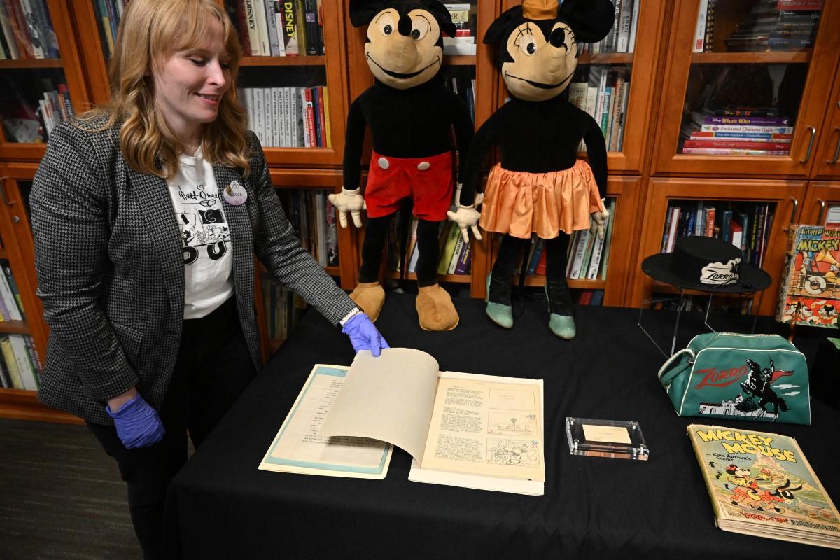 Archivist Nicole Carroll displays the original 1928 script for Disney's &lsquo;Steamboat Willie&rsquo;, the first cartoon to star Mickey Mouse.