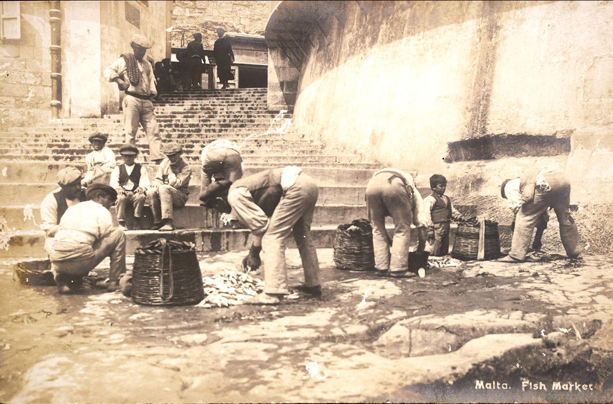 Salvatore Lorenzo Cassar issued this postcard of vendors at the marina fish market, circa 1920.