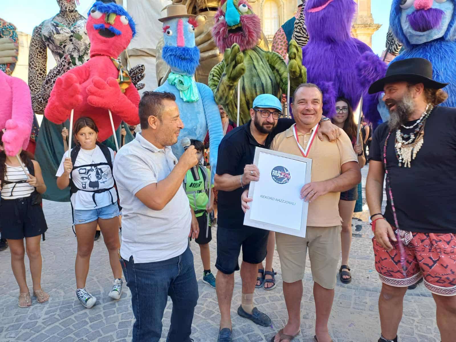 Għarb mayor David Apap Agius accepting recognition of the record-breaking feat on behalf of the local council. Photo: The Malta Records/Facebook.