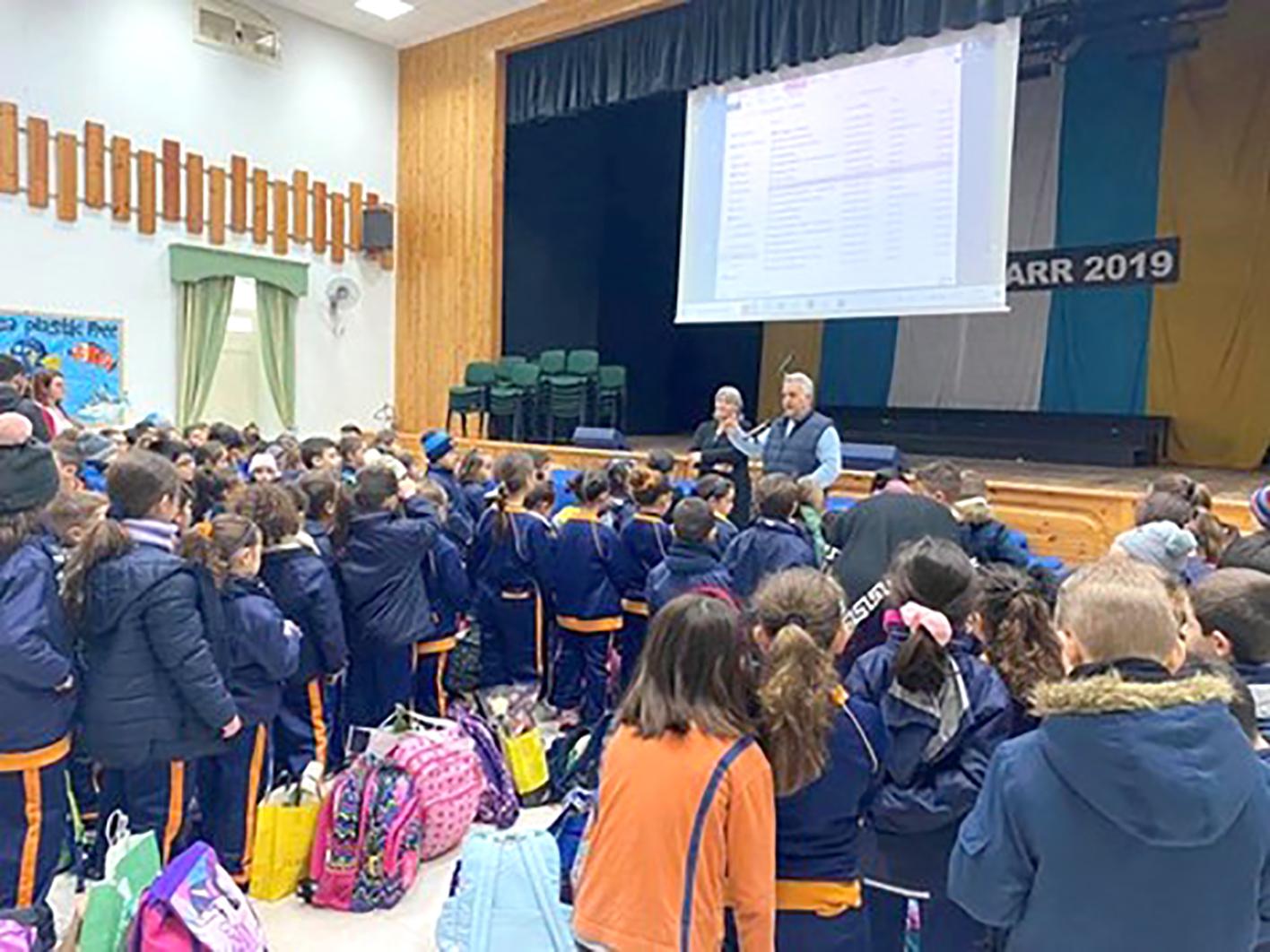 The mayor of Mġarr, Paul Vella, addressing the pupils of Mġarr primary in preparation for Mġarr Day.