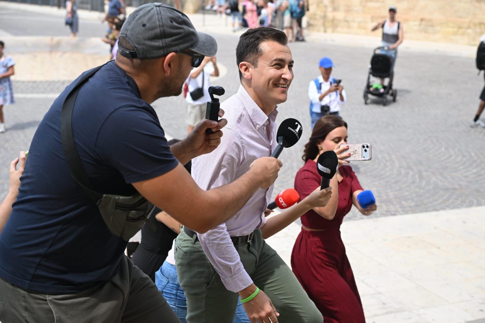 Silvio Schembri smiles as he enters Castille. Photo: Matthew Mirabelli